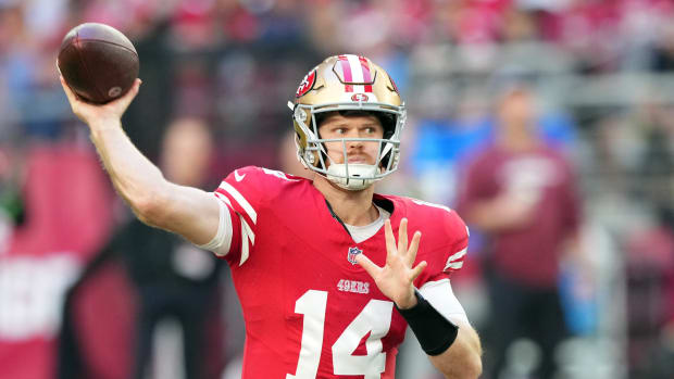 Dec 17, 2023; Glendale, Arizona, USA; San Francisco 49ers quarterback Sam Darnold (14) throws a pass against the Arizona Cardinals during the first half at State Farm Stadium. Mandatory Credit: Joe Camporeale-USA TODAY Sports  